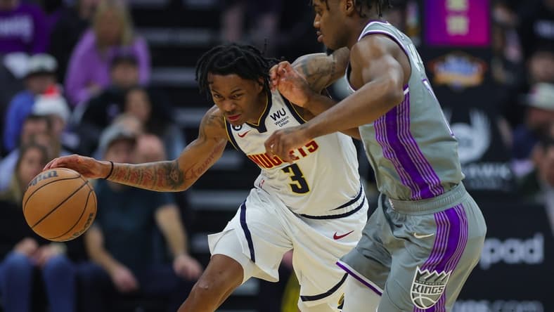 Dec 28, 2022; Sacramento, California, USA; Denver Nuggets guard Bones Hyland (3) dribbles the ball against Sacramento Kings guard Davion Mitchell (15) during the first quarter at Golden 1 Center. Mandatory Credit: Sergio Estrada-USA TODAY Sports