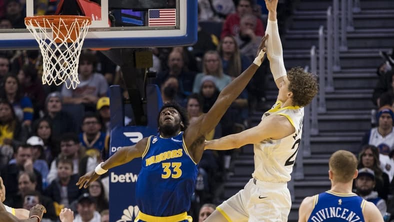 Dec 28, 2022; San Francisco, California, USA; Golden State Warriors center James Wiseman (33) fouls Utah Jazz forward Lauri Markkanen (23) during the first half at Chase Center. Mandatory Credit: John Hefti-USA TODAY Sports