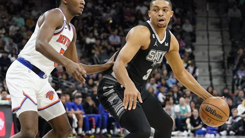 Dec 29, 2022; San Antonio, Texas, USA; San Antonio Spurs forward Keldon Johnson (3) drives to the basket against New York Knicks guard Immanuel Quickley (5) during the first half at AT&T Center. Mandatory Credit: Scott Wachter-USA TODAY Sports