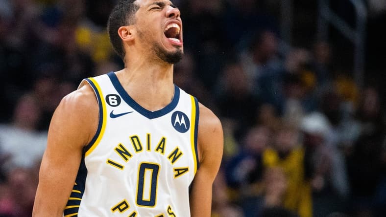 Dec 29, 2022; Indianapolis, Indiana, USA; Indiana Pacers guard Tyrese Haliburton (0) reacts to a made basket in the second half against the Cleveland Cavaliers at Gainbridge Fieldhouse. Mandatory Credit: Trevor Ruszkowski-USA TODAY Sports