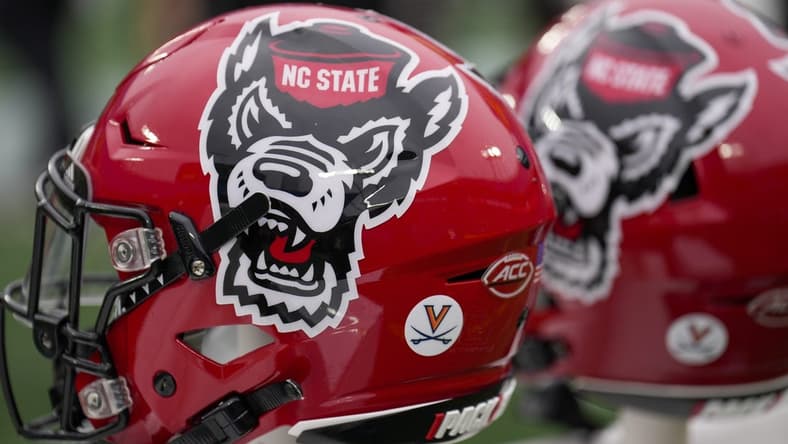 Dec 30, 2022; Charlotte, NC, USA; North Carolina State Wolfpack helmets during the first half against the Maryland Terrapins in the 2022 Duke's Mayo Bowl at Bank of America Stadium. Mandatory Credit: Jim Dedmon-USA TODAY Sports