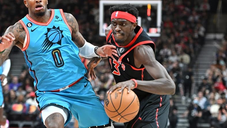 Dec 30, 2022; Toronto, Ontario, CAN; Toronto Raptors forward Pascal Siakam (43) dribbles the ball past Phoenix Suns forward Torrey Craig (0) in the first half at Scotiabank Arena. Mandatory Credit: Dan Hamilton-USA TODAY Sports
