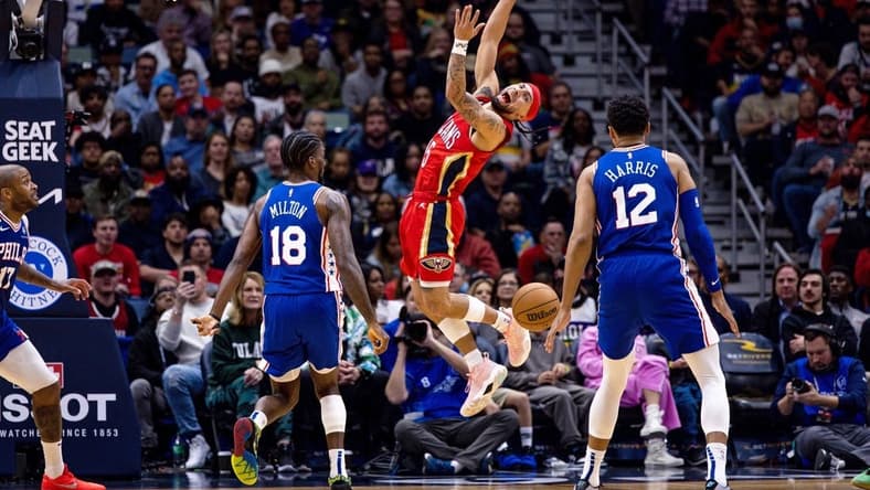 Dec 30, 2022; New Orleans, Louisiana, USA; New Orleans Pelicans guard Jose Alvarado (15) reacts after being fouled by Philadelphia 76ers guard Shake Milton (18) during the first half at Smoothie King Center. Mandatory Credit: Stephen Lew-USA TODAY Sports