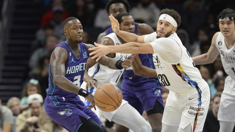 Dec 31, 2022; Charlotte, North Carolina, USA; Brooklyn Nets guard Seth Curry (30) loses the ball against Charlotte Hornets guard Terry Rozier (3) during the first half at the Spectrum Center. Mandatory Credit: Sam Sharpe-USA TODAY Sports