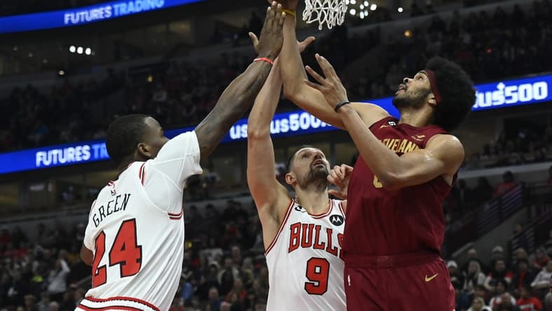 Dec 31, 2022; Chicago, Illinois, USA; Chicago Bulls forward Javonte Green (24) and Chicago Bulls center Nikola Vucevic (9) fight for a rebound against Cleveland Cavaliers center Jarrett Allen (31) during the first half at United Center. Mandatory Credit: Matt Marton-USA TODAY Sports