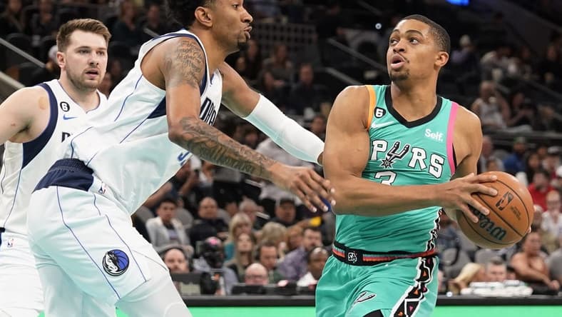 Dec 31, 2022; San Antonio, Texas, USA; San Antonio Spurs forward Keldon Johnson (3) drives to the basket against Dallas Mavericks center Christian Wood (35) during the first half at AT&T Center. Mandatory Credit: Scott Wachter-USA TODAY Sports