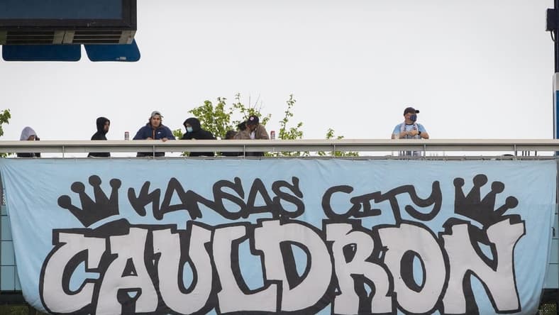 May 16, 2021; Kansas City, Kansas, USA; fans stand on the balcony over one of the club banners during the game between the Sporting Kansas City and the Vancouver Whitecaps at Children's Mercy Park. Mandatory Credit: William Purnell-USA TODAY Sports