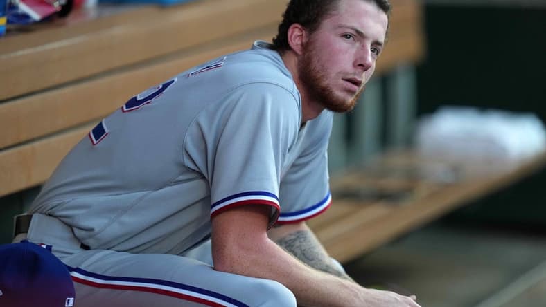 Sep 6, 2021; Anaheim, California, USA;  Texas Rangers starting pitcher A.J. Alexy (62) watches from the dugout in the second inning against the Los Angeles Angels at Angel Stadium. Mandatory Credit: Kirby Lee-USA TODAY Sports