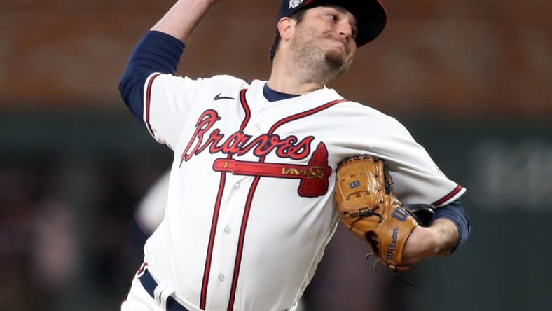 Oct 30, 2021; Atlanta, Georgia, USA; Atlanta Braves relief pitcher Luke Jackson (77) throws against the Houston Astros during the eighth inning of game four of the 2021 World Series at Truist Park. Mandatory Credit: Brett Davis-USA TODAY Sports