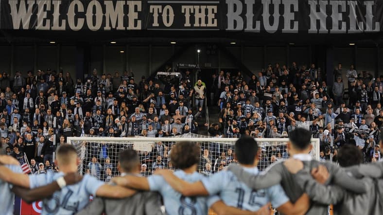 Nov 20, 2021; Kansas City, KS, USA; Sporting Kansas City players celebrate and salute the fans after defeating the Vancouver Whitecaps in a round one MLS Playoff game at Children's Mercy Park. Mandatory Credit: Amy Kontras-USA TODAY Sports