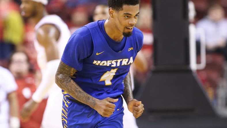 Dec 18, 2021; North Little Rock, Arkansas, USA; Hofstra Pride guard Aaron Estrada (4) celebrates after scoring in the second half against the Arkansas Razorbacks at Simmons Bank Arena. Hofstra won 89-81. Mandatory Credit: Nelson Chenault-USA TODAY Sports