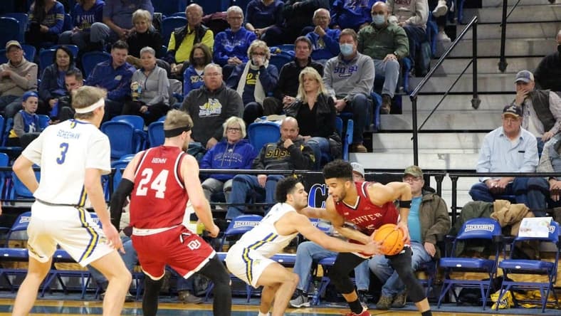 SDSU's Matt Mims defends Denver's Coban Porter during Saturday's Summit League game at Frost Arena.
Img 5787