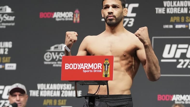Apr 8, 2022; Jacksonville, FL, USA; Julio Arce on the scale during weigh ins for UFC 273 at VyStar Veterans Memorial Stadium. Mandatory Credit: David Yeazell-USA TODAY Sports