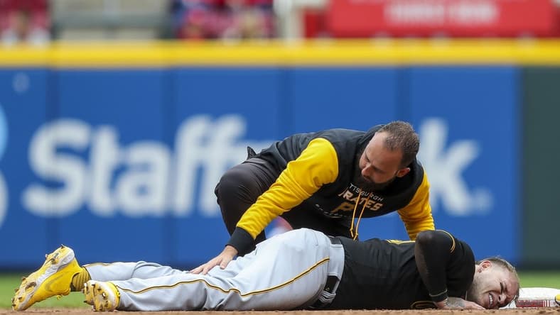 May 7, 2022; Cincinnati, Ohio, USA; Pittsburgh Pirates catcher Roberto Perez (55) lies on second injured in the eighth inning against the Cincinnati Reds at Great American Ball Park. Mandatory Credit: Katie Stratman-USA TODAY Sports
