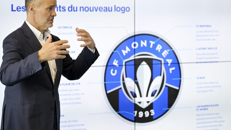 May 27, 2022; Montreal, Quebec, Canada; CF Montreal Chairman Joey Saputo with a screen explaining various elements of the new logo during a press conference to introduce the CF Montreal club logo to be used in the 2023 season. Mandatory Credit: Eric Bolte-USA TODAY Sports