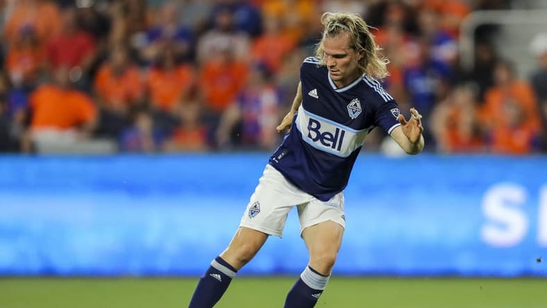 Jul 13, 2022; Cincinnati, Ohio, USA; Vancouver Whitecaps' Florian Jungwirth (26) dribbles against FC Cincinnati in the second half at TQL Stadium. Mandatory Credit: Katie Stratman-USA TODAY Sports