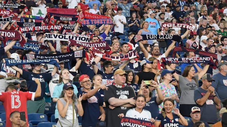 Jul 30, 2022; Foxborough, MA, USA; New England Revolution fans salute the team's entrance for the start of a match against the Toronto FC at Gillette Stadium. Mandatory Credit: Eric Canha-USA TODAY Sports