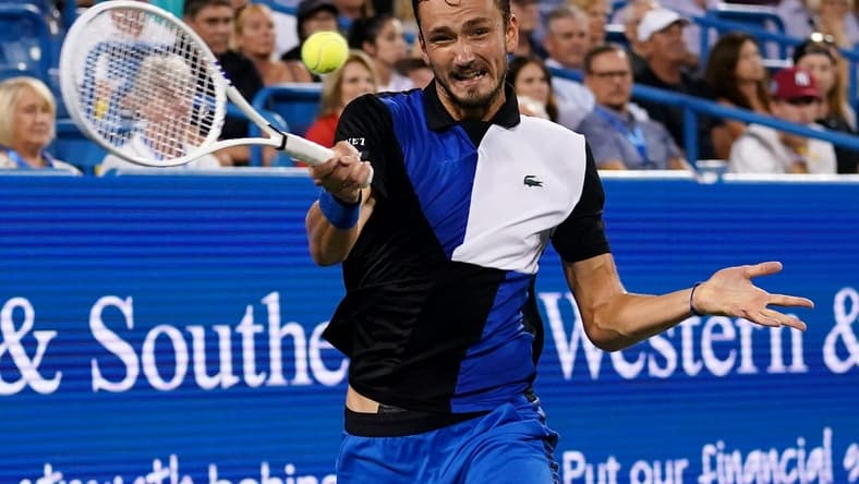 Daniil Medvedev, of Russia, returns a shot against Stefanos Tsitsipas, of Greece, during a semifinal match of the Western & Southern open tennis tournament, Saturday, Aug. 20, 2022, at the Lindner Family Tennis Center in Mason, Ohio.
Western Southern Open Tennis Tournament Aug 20 0083