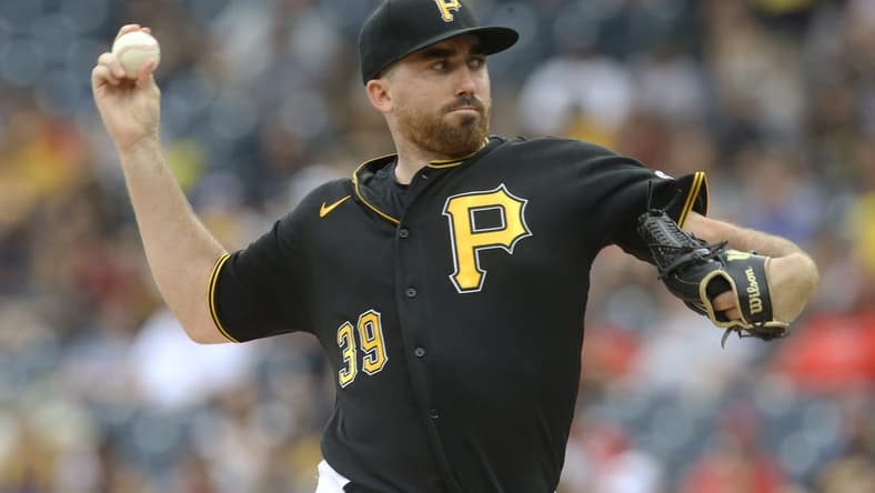 Aug 21, 2022; Pittsburgh, Pennsylvania, USA; Pittsburgh Pirates starting pitcher Zach Thompson (39) delivers a pitch against the Cincinnati Reds during the first inning at PNC Park. Mandatory Credit: Charles LeClaire-USA TODAY Sports