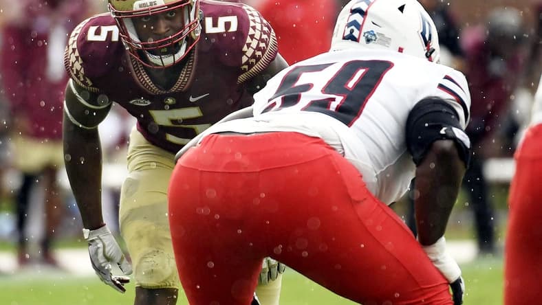 Aug 27, 2022; Tallahassee, Florida, USA; Florida State Seminoles defensive end Jared Verse (5) lines up against Duquesne Dukes offensive lineman Chris Oliver (59) during the first half at Doak S. Campbell Stadium. Mandatory Credit: Melina Myers-USA TODAY Sports