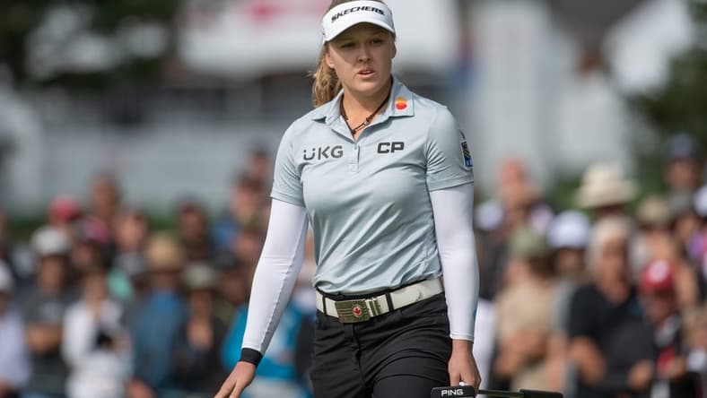 Aug 27, 2022; Ottawa, Ontario, CAN; Brooke Henderson from Canada follows the ball after a putt on the green of the 1st hole during the third round of the CP Women's Open golf tournament. Mandatory Credit: Marc DesRosiers-USA TODAY Sports
