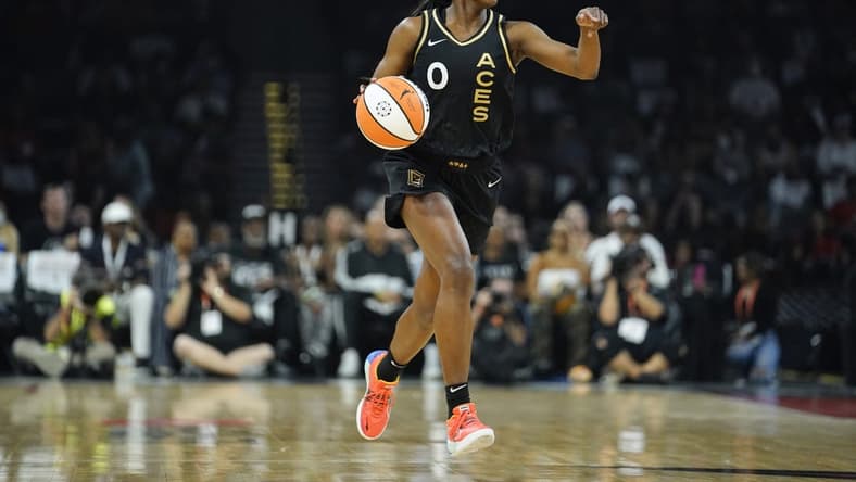 Sep 13, 2022; Las Vegas, Nevada, USA; Las Vegas Aces guard Jackie Young (0) dribbles the ball during the first quarter against the Connecticut Sun in game two of the WNBA Finals at Michelob Ultra Arena. Mandatory Credit: Lucas Peltier-USA TODAY Sports
