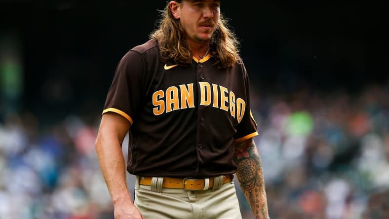 Sep 14, 2022; Seattle, Washington, USA;  San Diego Padres starting pitcher Mike Clevinger (52) walks off the field after throwing against the Seattle Mariners during the first inning at T-Mobile Park. Mandatory Credit: Lindsey Wasson-USA TODAY Sports