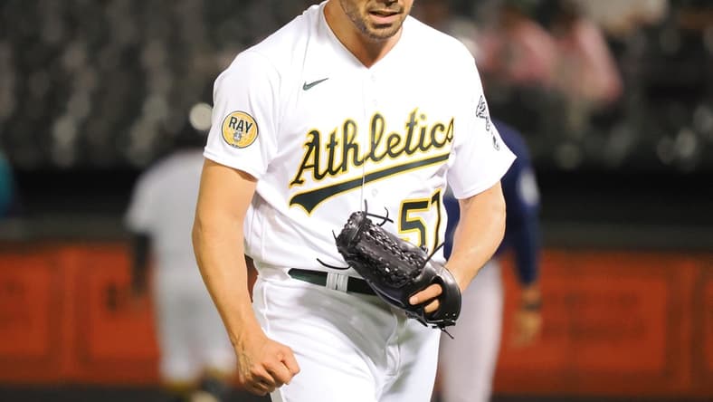 Sep 20, 2022; Oakland, California, USA; Oakland Athletics pitcher Tyler Cyr (57) celebrates after the top of the eighth inning against the Seattle Mariners at RingCentral Coliseum. Mandatory Credit: Kelley L Cox-USA TODAY Sports