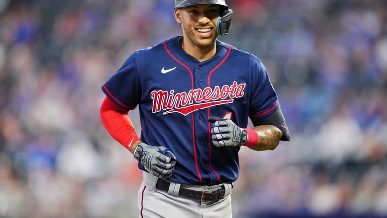 Sep 20, 2022; Kansas City, Missouri, USA; Minnesota Twins shortstop Carlos Correa (4) reacts while running off the field during the first inning against the Kansas City Royals at Kauffman Stadium. Mandatory Credit: Jay Biggerstaff-USA TODAY Sports