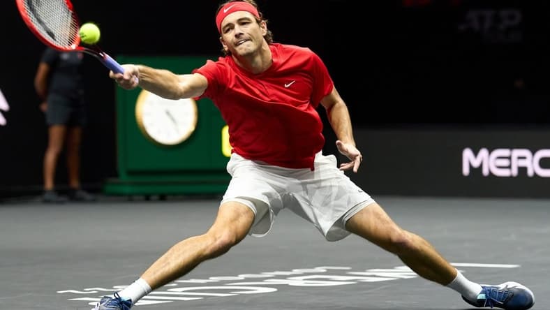 Sep 24, 2022; London, United Kingdom;Taylor Fritz (USA) plays a shot against Cameron Norrie (GBR) in a Laver Cup singles match.  Mandatory Credit: Peter van den Berg-USA TODAY Sports