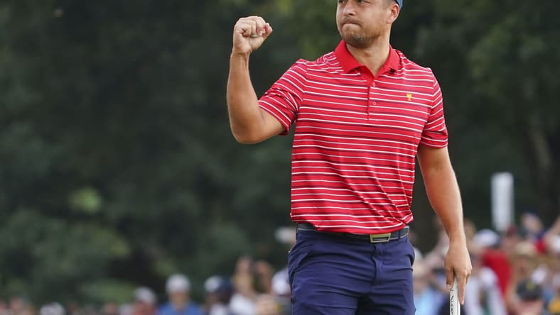 Sep 25, 2022; Charlotte, North Carolina, USA; Team USA golfer Xander Schauffele celebrates clinching the win for Team USA on the 18th green during the singles match play of the Presidents Cup golf tournament at Quail Hollow Club. Mandatory Credit: Peter Casey-USA TODAY Sports