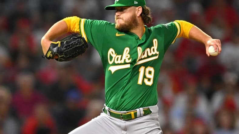 Sep 29, 2022; Anaheim, California, USA; Oakland Athletics starting pitcher Cole Irvin (19) throws to the plate in the third inning against the Los Angeles Angels at Angel Stadium. Mandatory Credit: Jayne Kamin-Oncea-USA TODAY Sports