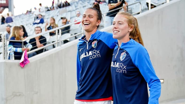 Sep 30, 2022; San Diego, California, USA; North Carolina Courage defender Carson Pickett (left) and midfielder Tess Boade (right) walk to the field before the game against the San Diego Wave FC at Snapdragon Stadium. Mandatory Credit: Ray Acevedo-USA TODAY Sports