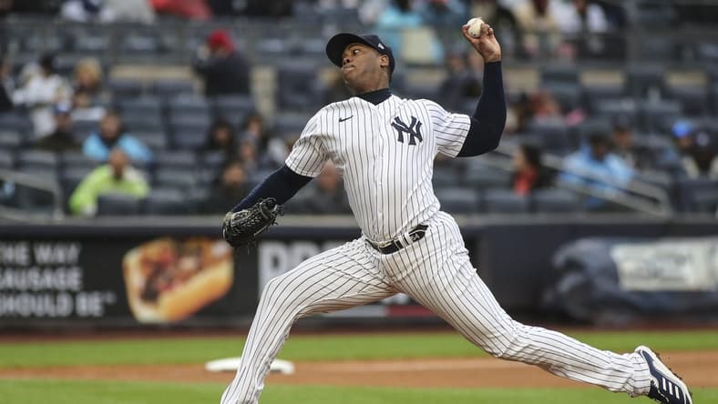 Oct 2, 2022; Bronx, New York, USA; New York Yankees relief pitcher Aroldis Chapman (54) pitches in the seventh inning against the Baltimore Orioles at Yankee Stadium. Mandatory Credit: Wendell Cruz-USA TODAY Sports