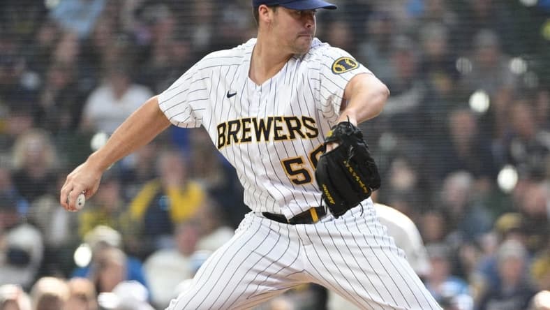 Oct 2, 2022; Milwaukee, Wisconsin, USA; Milwaukee Brewers relief pitcher Justin Topa (56) delivers a pitch in the sixth inning against the Miami Marlins at American Family Field. Mandatory Credit: Michael McLoone-USA TODAY Sports