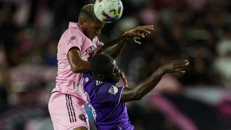 Oct 5, 2022; Fort Lauderdale, Florida, USA;  Inter Miami defender Damion Lowe (31) heads the ball over Orlando City forward Benji Michel (19) in the first half at DRV PNK Stadium. Mandatory Credit: Nathan Ray Seebeck-USA TODAY Sports