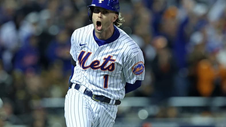 Oct 8, 2022; New York City, New York, USA; New York Mets second baseman Jeff McNeil (1) reacts after hitting a two run double against the San Diego Padres in the seventh inning during game two of the Wild Card series for the 2022 MLB Playoffs at Citi Field. Mandatory Credit: Brad Penner-USA TODAY Sports