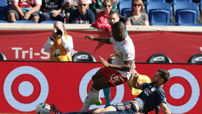 Oct 15, 2022; Harrison, New Jersey, USA; FC Cincinnati defender Matt Miazga (21) slide tackles New York Red Bulls forward Elias Manoel (11) during the second half at Red Bull Arena. Mandatory Credit: Vincent Carchietta-USA TODAY Sports