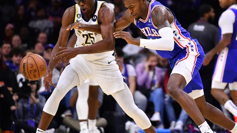 Oct 24, 2022; Philadelphia, Pennsylvania, USA; Indiana Pacers forward Jalen Smith (25) and Philadelphia 76ers forward Paul Reed (44) dive for a loose ball in the second quarter at Wells Fargo Center. Mandatory Credit: Kyle Ross-USA TODAY Sports