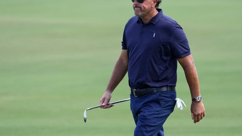 Oct 28, 2022; Miami, Florida, USA; Phil Mickelson walks up the fairway of the first hole during the first round of the season finale of the LIV Golf series at Trump National Doral. Mandatory Credit: Jasen Vinlove-USA TODAY Sports