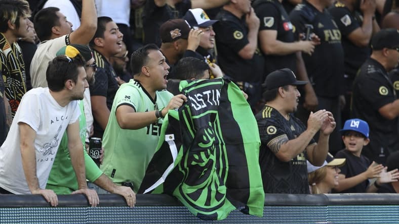 Oct 30, 2022; Los Angeles, California, USA; An Austin FC fan cheers during the conference finals for the Audi 2022 MLS Cup Playoffs against the Los Angeles FC at Banc of California Stadium. Mandatory Credit: Kiyoshi Mio-USA TODAY Sports