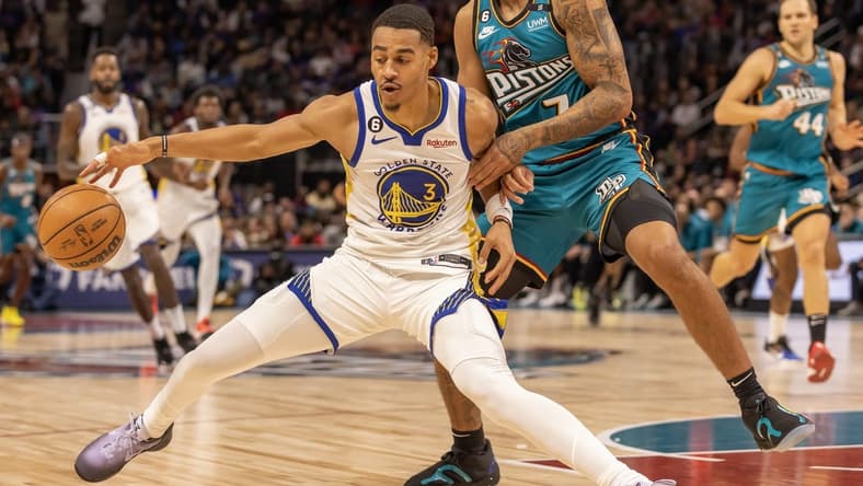 Oct 30, 2022; Detroit, Michigan, USA; Detroit Pistons guard Killian Hayes (7) defends against Golden State Warriors guard Jordan Poole (3) during the in the first half at Little Caesars Arena. Mandatory Credit: David Reginek-USA TODAY Sports