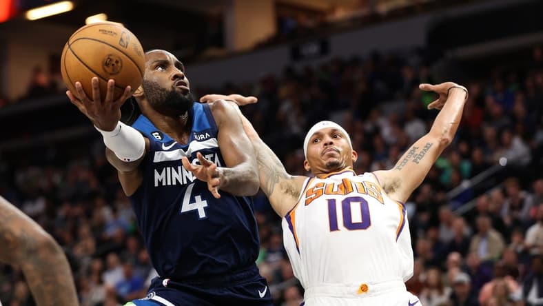 Nov 9, 2022; Minneapolis, Minnesota, USA; Minnesota Timberwolves guard Jaylen Nowell (4) shoots the ball while Phoenix Suns guard Damion Lee (10) defends during the second quarter at Target Center. Mandatory Credit: Matt Krohn-USA TODAY Sports