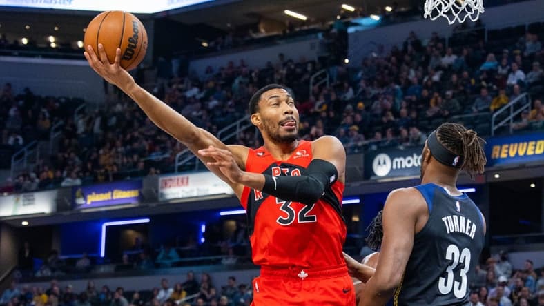 Nov 12, 2022; Indianapolis, Indiana, USA; Toronto Raptors forward Otto Porter Jr. (32) shoots the ball while Indiana Pacers center Myles Turner (33) defends in the first quarter at Gainbridge Fieldhouse. Mandatory Credit: Trevor Ruszkowski-USA TODAY Sports