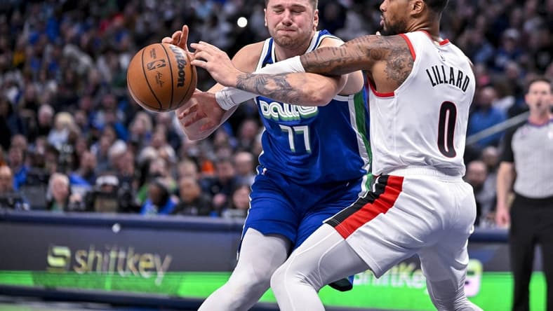 Nov 12, 2022; Dallas, Texas, USA; Dallas Mavericks guard Luka Doncic (77) and Portland Trail Blazers guard Damian Lillard (0) in action during the game between the Dallas Mavericks and the Portland Trail Blazers at the American Airlines Center. Mandatory Credit: Jerome Miron-USA TODAY Sports