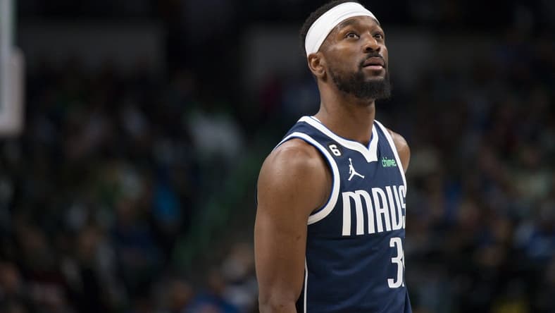 Dec 16, 2022; Dallas, Texas, USA; Dallas Mavericks guard Kemba Walker (34) checks the scoreboard as he enters the game against the Portland Trail Blazers during the second quarter at the American Airlines Center. Mandatory Credit: Jerome Miron-USA TODAY Sports