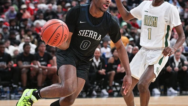 Sierra Canyon's Bronny James drives against Akron St. Vincent-St. Mary's Lance Hayes during the Ohio Play-by-Play Classic on Dec. 17 at Nationwide Arena.