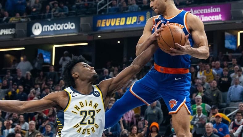 Dec 18, 2022; Indianapolis, Indiana, USA; Indiana Pacers forward Aaron Nesmith (23) and New York Knicks guard Quentin Grimes (6) go for a rebound in the second half at Gainbridge Fieldhouse. Mandatory Credit: Trevor Ruszkowski-USA TODAY Sports
