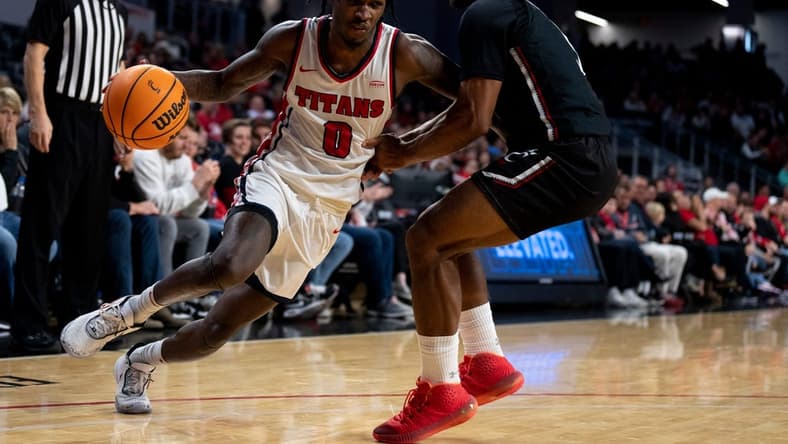 Detroit Mercy Titans guard Antoine Davis (0) drives on Cincinnati Bearcats guard David DeJulius (5) in the second half of the NCAA men   s basketball game at Fifth Third Arena in Cincinnati on Wednesday, Dec. 21, 2022. Cincinnati Bearcats defeated Detroit Mercy Titans 72-54.

Ncaa Basketball Detroit Mercy Titans At Cincinnati Bearcats