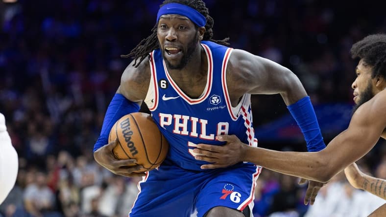 Dec 21, 2022; Philadelphia, Pennsylvania, USA; Philadelphia 76ers center Montrezl Harrell (5) drives with the ball against Detroit Pistons forward Marvin Bagley III (35) during the third quarter at Wells Fargo Center. Mandatory Credit: Bill Streicher-USA TODAY Sports